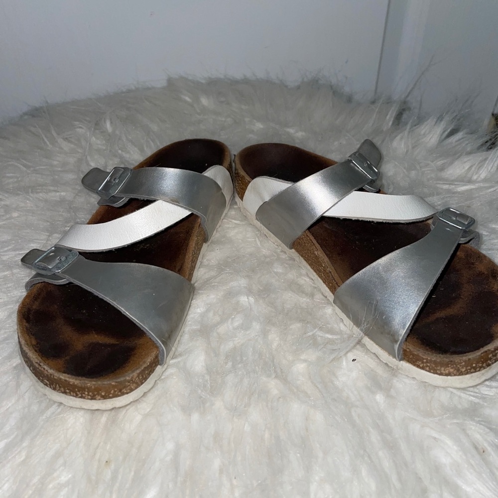 Birkenstock’s with silver and white straps